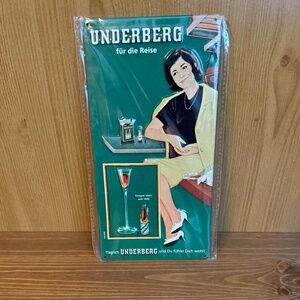 New Underberg Tin Sign Woman Sitting